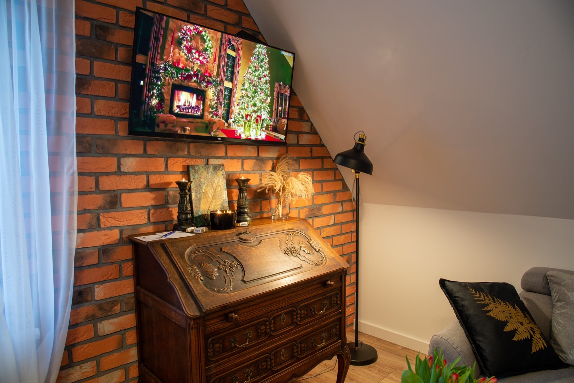 Exposed brick and timber in the Długa attic — one of our Gdańsk Old Town homes