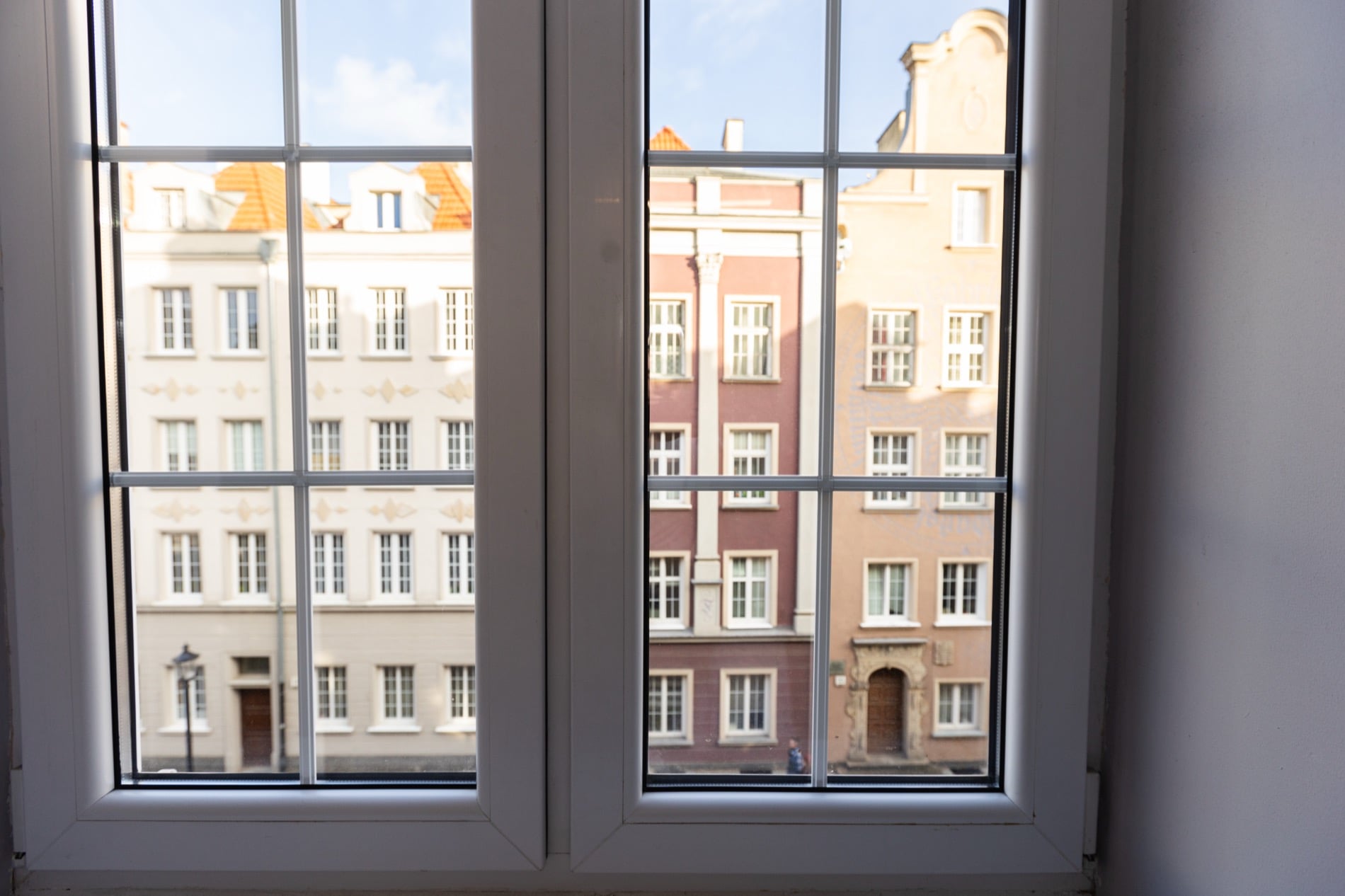 Ogarna Loft with exposed brick and gold accents in Gdańsk Old Town — interior view 2