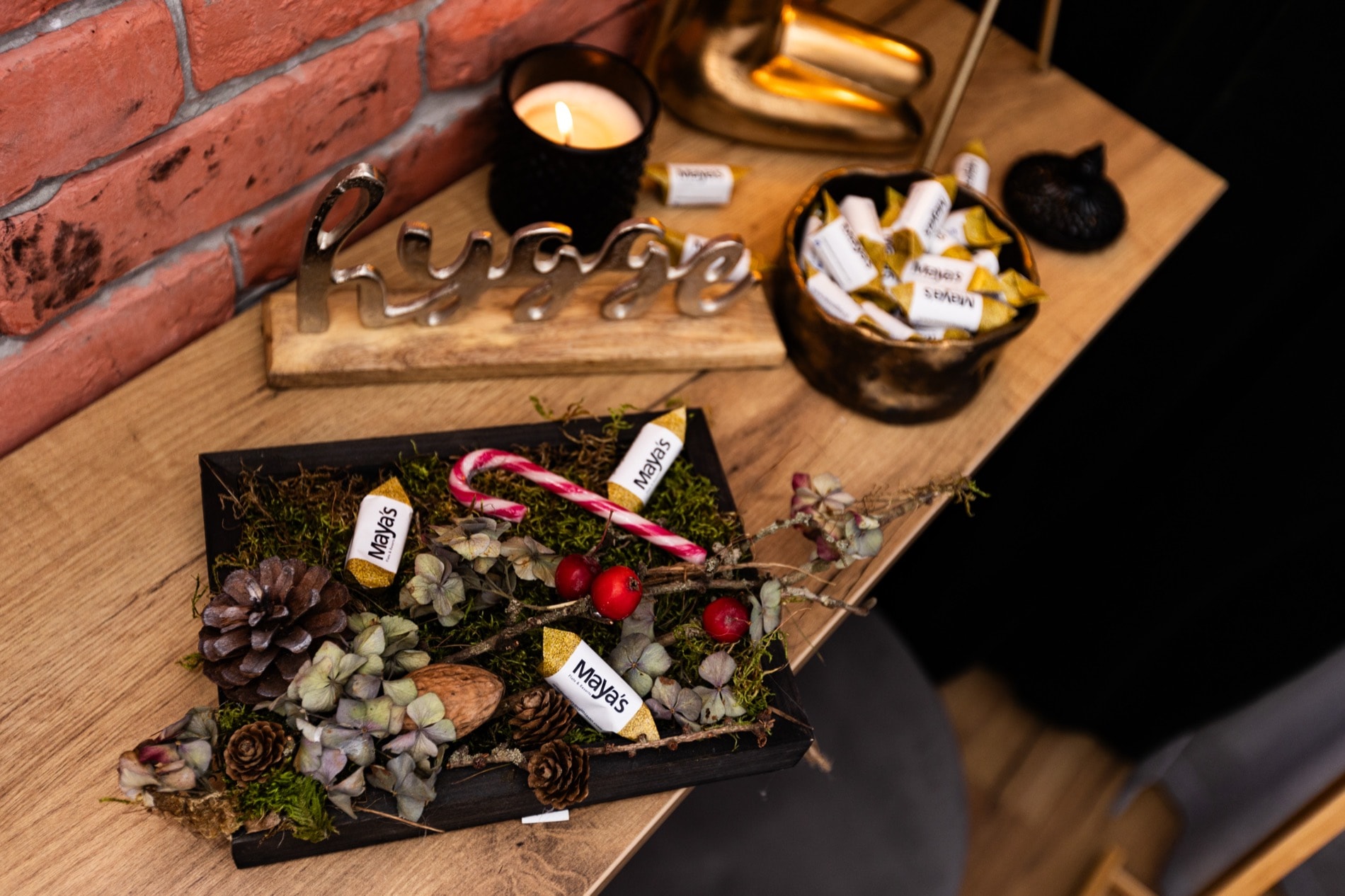 A candlelit welcome table with Maya's sweets at Ogarna Loft